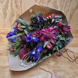Waratah, freesias and iris are a few of the flowers in this wild mix of flowers and foliage