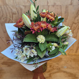 Bouquet of white and brown flowers.