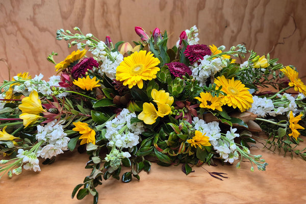 Florist choice seasonal casket spray