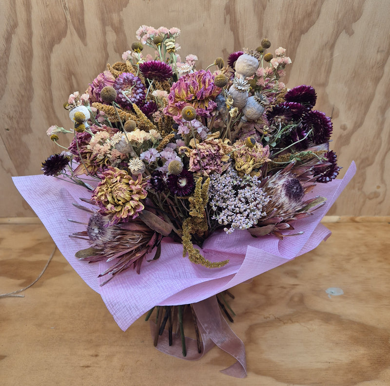 Dusky pinks and burgundy dried flower bouquet