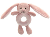 Pink knitted bunny rattle toy on a white background