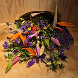 Colourful bouquet of flowers on a wooden surface